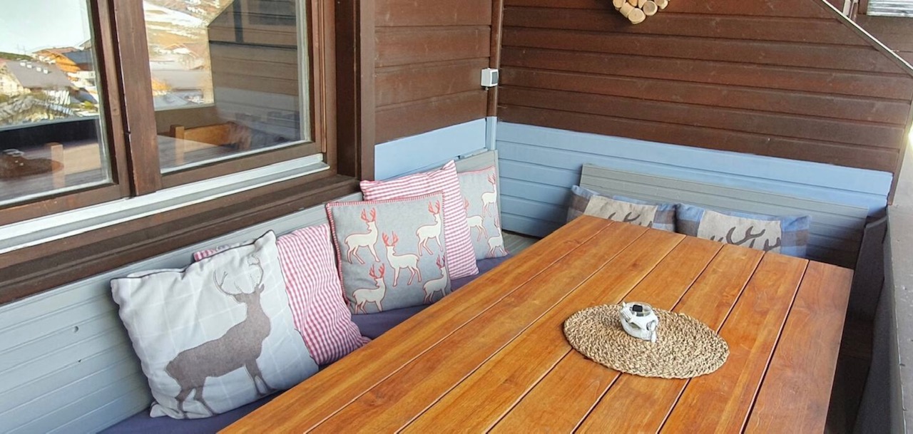 Cosy balcony with seating for up to 8 people